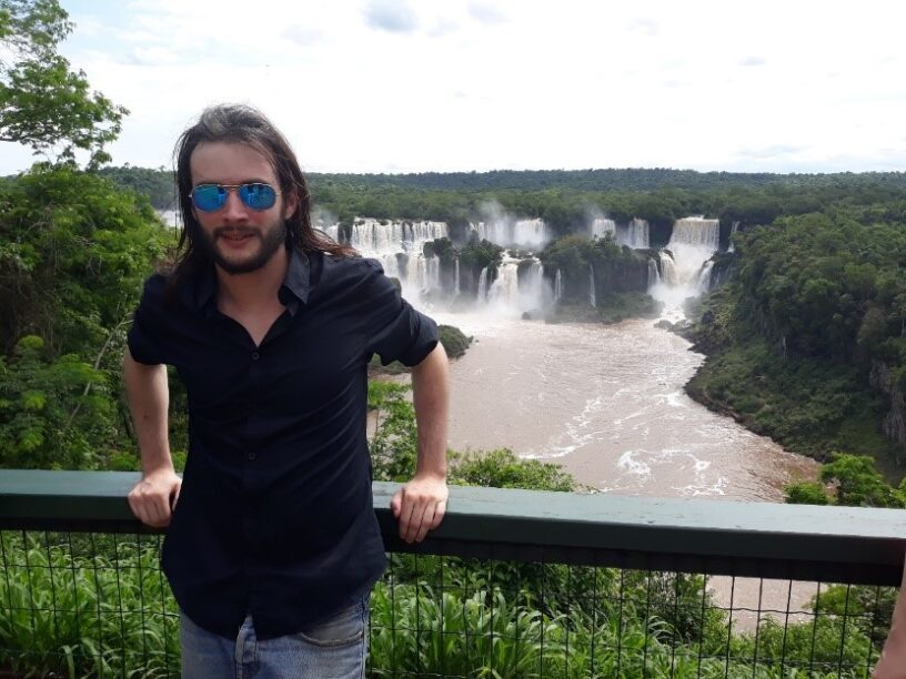 Nikolas Thepot in front of the Iguazu Falls located on the border between Brazil and Argentina. © Nikolas Thepot