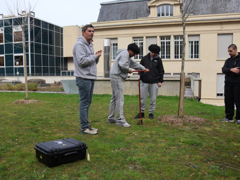 Steve Peuble accompanies the students to sample some soil from Saint-Étienne